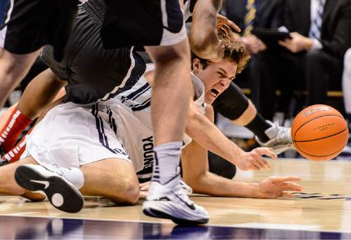 Trent Nelson  |  The Salt Lake Tribune
Brigham Young Cougars forward Luke Worthington (41) dives for a loose ball as BYU hosts Gonzaga, men's college basketball at the Marriott Center in Provo, Saturday December 27, 2014.