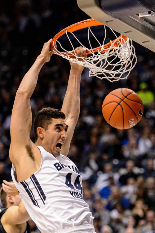 Trent Nelson  |  The Salt Lake Tribune
Brigham Young Cougars center Corbin Kaufusi (44) dunks as BYU hosts Gonzaga, men's college basketball at the Marriott Center in Provo, Saturday December 27, 2014.