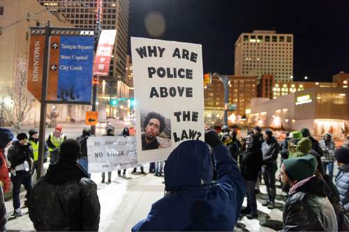 Trent Nelson  |  The Salt Lake Tribune
Approximately sixty people braved the cold weather for a protest against police brutality in Salt Lake City, Wednesday December 31, 2014.
