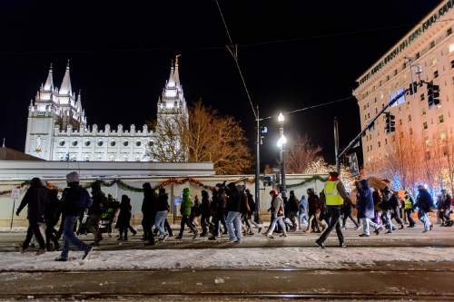 Trent Nelson  |  The Salt Lake Tribune
Protesters march through downtown Salt Lake City after a rally against police brutality, Wednesday December 31, 2014.