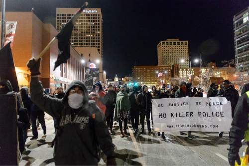 Trent Nelson  |  The Salt Lake Tribune
Approximately sixty protesters walk down State Street following a rally against police brutality in Salt Lake City, Wednesday December 31, 2014.