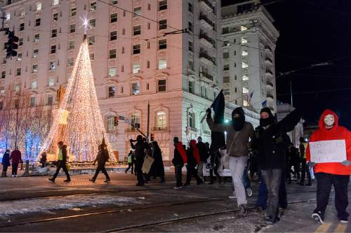 Trent Nelson  |  The Salt Lake Tribune
Protesters march through downtown Salt Lake City after a rally against police brutality, Wednesday December 31, 2014.