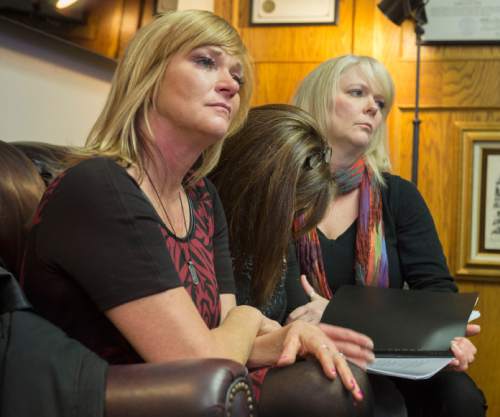 Steve Griffin  |  The Salt Lake Tribune


Susan Hunt, center, lowers her head and weeps as she is consoled by her sisters Cindy Moss, left, and Barbara Houston, as they listen to attorney Robert Sykes as he details a lawsuit he is filling against Saratoga Springs for the shooting death of Susan Hunt's son Darrian Hunt. Sykes was speaking from his law offices in Salt Lake City, Friday, January 2, 2015.
