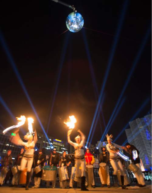 Steve Griffin  |  The Salt Lake Tribune


A giant MirrorBall spins in the night sky as the group Sambafogo play music and fire dance as Salt Lake rings in the new year during Eve celebrations at the Salt Palace Convention Center in Salt Lake City, Wednesday, December 31, 2014. Officials with the Downtown Alliance say this massive installation is the largest mirrored sphere in the United States. It is 20 ft in diameter, more than 60 ft in circumference and built with 1200 square mirrors. MirrorBall weighs in at 2433 lbs.