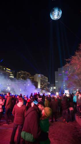 Steve Griffin  |  The Salt Lake Tribune


A giant MirrorBall spins in the night sky as Salt Lake rings in the new year during Eve celebrations at the Salt Palace Convention Center in Salt Lake City, Wednesday, December 31, 2014. Officials with the Downtown Alliance say this massive installation is the largest mirrored sphere in the United States. It is 20 ft in diameter, more than 60 ft in circumference and built with 1200 square mirrors. MirrorBall weighs in at 2433 lbs.