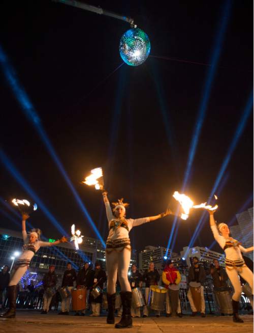 Steve Griffin  |  The Salt Lake Tribune


A giant MirrorBall spins in the night sky as the group Sambafogo play music and fire dance as Salt Lake rings in the new year during Eve celebrations at the Salt Palace Convention Center in Salt Lake City, Wednesday, December 31, 2014. Officials with the Downtown Alliance say this massive installation is the largest mirrored sphere in the United States. It is 20 ft in diameter, more than 60 ft in circumference and built with 1200 square mirrors. MirrorBall weighs in at 2433 lbs.