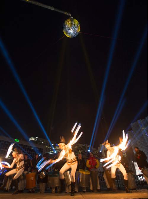 Steve Griffin  |  The Salt Lake Tribune


A giant MirrorBall spins in the night sky as the group Sambafogo play music and fire dance as Salt Lake rings in the new year during Eve celebrations at the Salt Palace Convention Center in Salt Lake City, Wednesday, December 31, 2014. Officials with the Downtown Alliance say this massive installation is the largest mirrored sphere in the United States. It is 20 ft in diameter, more than 60 ft in circumference and built with 1200 square mirrors. MirrorBall weighs in at 2433 lbs.