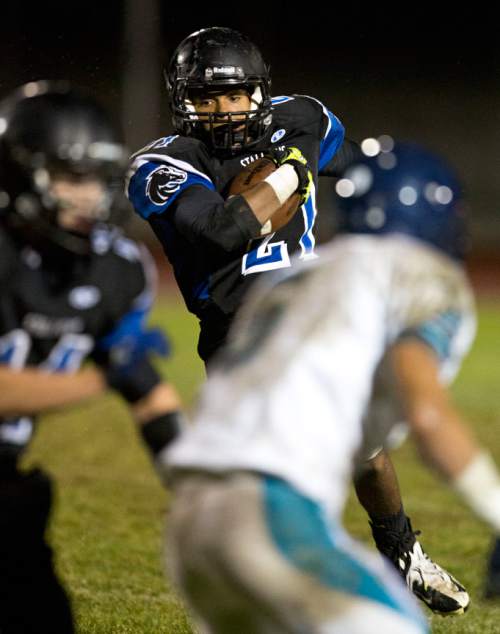 Lennie Mahler  |  The Salt Lake Tribune
Stansbury's Jesse Horowitz rushes the ball against Juan Diego in a high school football game on Thursday, Oct. 10, 2013.