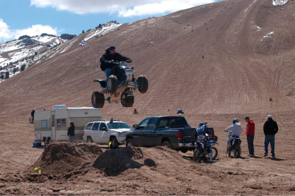 Tom Wharton  |  Tribune file photo
An ATV rider uses a jump made of sand to take some air at Little Sahara Recreation Area's Sand Mountain.