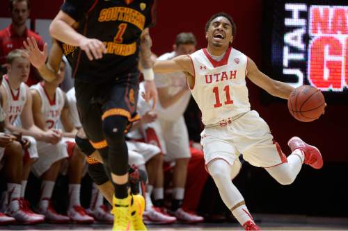 Scott Sommerdorf   |  The Salt Lake Tribune
Utah Utes guard Brandon Taylor (11) reacts as he felt he was fouled as he drives during first half play. Utah held a 39-22 lead over the USC Trojans at the half, Friday, January 2, 2015.