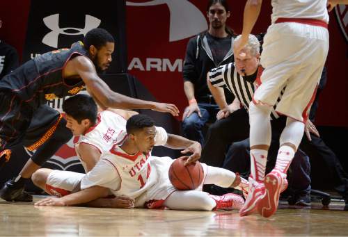 Scott Sommerdorf   |  The Salt Lake Tribune
Utah Utes guard/forward Dakarai Tucker (14) comes up with a loose ball on a USC turnover during first half play. Utah held a 39-22 lead over the USC Trojans at the half, Friday, January 2, 2015.