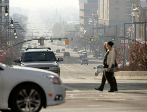 l Hartmann  |  The Salt Lake Tribune
View looking south down State Street from North Temple Street.  Air pollution, (pm 2.5) begins building up in downtown Salt Lake City Tuesday Jan. 6.  It looks worse than it is.  The Utah Department of Environmental Quality's measurement was about 20  for pm 2.5, putting it into the yellow mandatory action range.  Stay tuned for more of the same for the next few days.