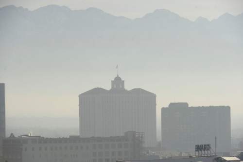 Al Hartmann  |  The Salt Lake Tribune
View from the Gateway looking southeast to the Grand America Hotel.  Air pollution, (pm 2.5) begins building up in downtown Salt Lake City Tuesday Jan. 6.  It looks worse than it is.  The Utah Department of Environmental Quality's measurement was about 20  for pm 2.5, putting it into the yellow mandatory action range.  Stay tuned for more of the same for the next few days.