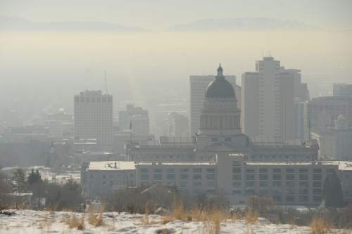 Al Hartmann  |  The Salt Lake Tribune
View from the Utah State Capitol looking south down State Street.  Air pollution, (pm 2.5) begins building up in downtown Salt Lake City Tuesday Jan. 6.  It looks worse than it is.  The Utah Department of Environmental Quality's measurement was about 20  for pm 2.5, putting it into the yellow mandatory action range.  Stay tuned for more of the same for the next few days.