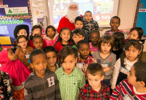 Rick Egan  |  The Salt Lake Tribune

Ken Limb, principal of Mountain View Elementary School, dressed like Santa Claus, poses for photo with kindergarten students, Friday, December 19, 2014