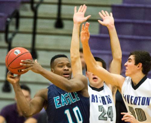 Rick Egan  |  The Salt Lake Tribune

Maliik Fagan -Foster (10) Juan Diego, is double teamed by Denver Nageli (24) and Jeff Aren's (30) of Riverton, s   in the championship game of the Holiday Prep Tournament at Riverton High, Wednesday, December 31, 2014
