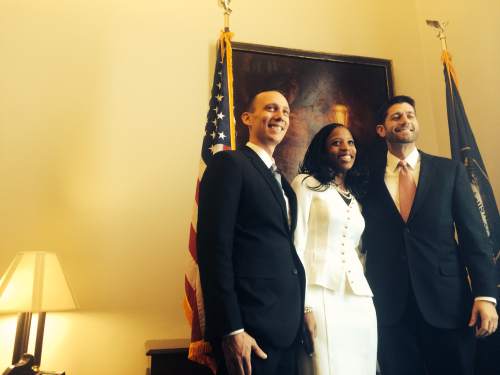 Thomas Burr  |  The Salt Lake Tribune
Rep. Mia Love, R-Utah, center, poses for photos with her husband, Jason, left, and Rep. Paul Ryan, R-Wisc., right, on Tuesday ahead of being sworn into Congress as Utah's newest member.