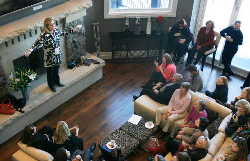 Scott Sommerdorf  l  The Salt Lake Tribune
Geralyn Dreyfous (far left) climbed up on the hearth to speak to roughly 100 guests in Jcki Zehner's home in Park Meadows, where she met with Gloria Steinem, Geena Davis, and other women connected to the movie industry, Sunday, 1/23/2011.