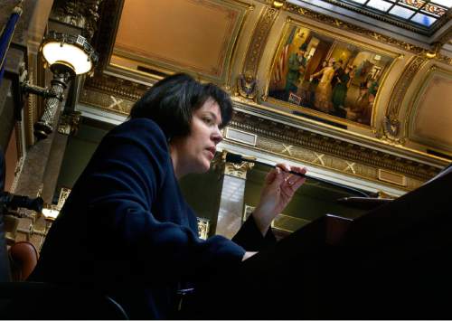Scott Sommerdorf  |  The Salt Lake Tribune
New Utah Speaker of the House, Becky Lockhart conducts the business of the House of Representatives, Thursday, 2/3/2011 as the first female Speaker in the state's history. She works under a painting in the House chamber depicting Utah's first municipal vote cast by a woman on Feb. 14th of 1870.
