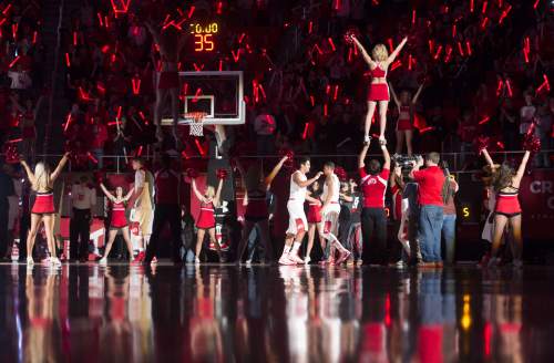 Steve Griffin  |  The Salt Lake Tribune

Fans wave glow sticks as the Utes are introduced during first half action in the Utah versus UCLA men's basketball game at the Huntsman Center in Salt Lake City, Sunday, Jan. 4, 2015.