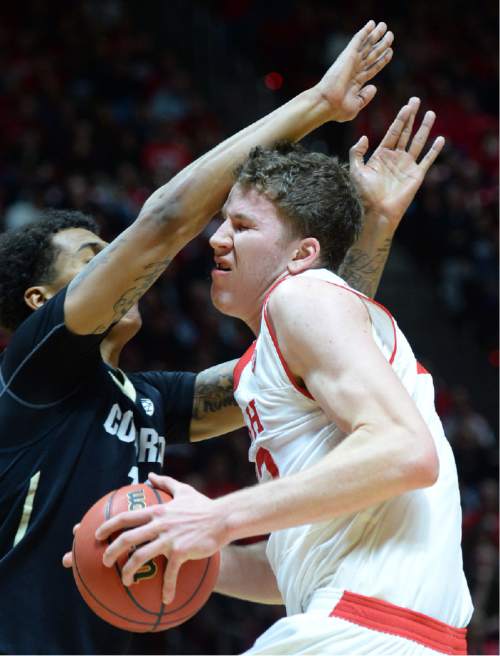 Steve Griffin  |  The Salt Lake Tribune


Utah Utes forward Jakob Poeltl (42) gets smashed in the face by the arm of Colorado Buffaloes guard/forward Dustin Thomas (13) during first half action in the Utah versus Colorado men's basketball game at the Huntsman Center in Salt Lake City, Wednesday, January 7, 2015.