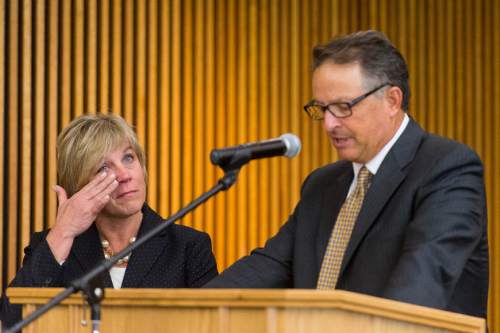 Trent Nelson  |  The Salt Lake Tribune
Dr. Deneece G. Huftalin, left, wipes away a tear after being named the new President of Salt Lake Community College as she's introduced by Daniel Campbell, Chair of the Utah State Board of Regents, Thursday September 11, 2014.