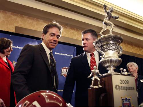 COACHES PRESS CONFERENCE
Utah coach Kyle Whittingham (R), and Alabama coach Nick Saban met and posed for photos with the Sugar Bowl trophy at a press conference, Thursday, 1/1/09.
Scott Sommerdorf / The Salt Lake Tribune