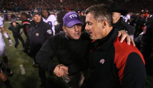 Utah head coach Kyle Whittingham, right, is met in the middle of the field by TCU head coach Gary Patterson.  The 10th-ranked Utes defeated No. 11 TCU 13-10 at Rice-Eccles Stadium on Thursday, November 6, 2008.
Scott Sommerdorf / The Salt Lake Tribune