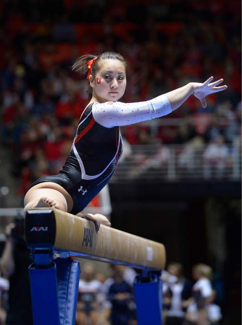 Scott Sommerdorf   |  The Salt Lake Tribune
Corrie Lothrop during her 9.825 balance bean routine as the Utah Red Rocks beat Arizona 197.825 to 194.425, Friday, Feb. 7, 2014.