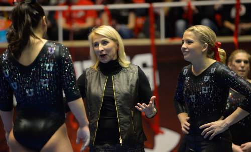 Rick Egan  | The Salt Lake Tribune 

Corrie Lothrop gets some ti[ps form coach Megan Marsden, before she competes on the beam for the Utes, in Pac12 gymnastics competition, Utah vs. UCLA, at the Huntsman Center, Saturday, January 25, 2014.