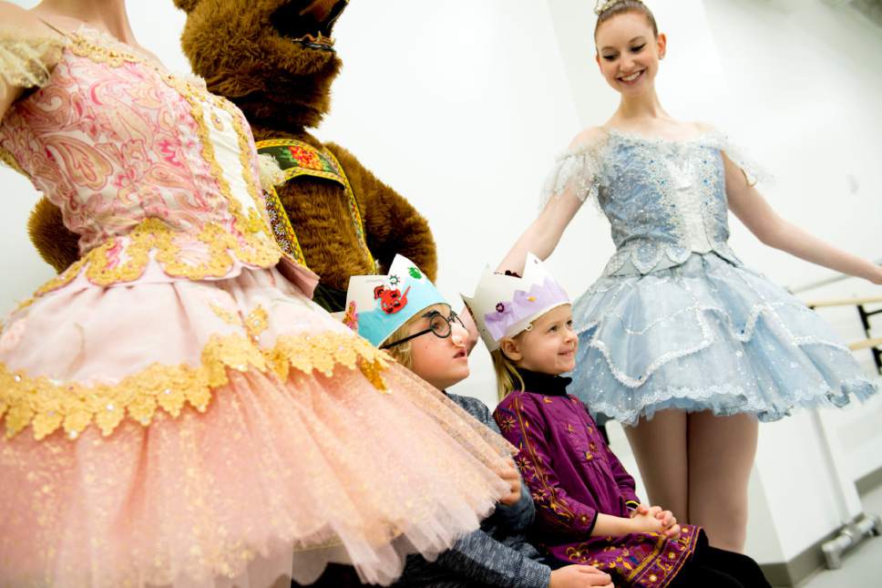 Jeremy Harmon  |  The Salt Lake Tribune
Sawyer Paschel-Harbour dons a plastic nose and glasses as he and his sister, Wren Paschel-Harbour,  get their photo taken with dancers at the Frederick Quinney Lawson Ballet West Academy at the newly opened Jessie Eccles Quinney Ballet Center. The dancers are Cassie Macy, left, Andrew Hunter, center, and Taylor Arel are all students at the Academy. The school held an open house on Saturday, Jan. 10, 2015 for the newly opened facility.