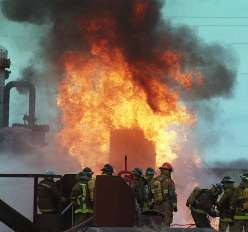 Tim Kelly  |  The Salt Lake Tribune

Firefighters battle a blaze in 1997.