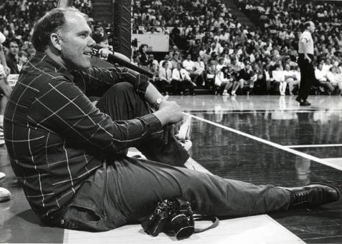 photo courtesy Kelly family

Former Tribune staffer Tim Kelly sits on the sidelines while covering a Jazz game in this undated photo.