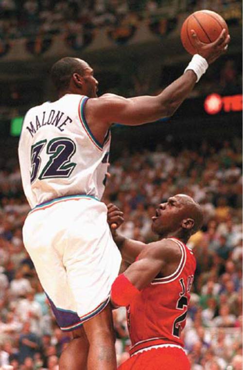 Tim Kelly  |  The Salt Lake Tribune

Karl Malone shoots over Michael Jordan in this photo from the 1997 NBA Finals.