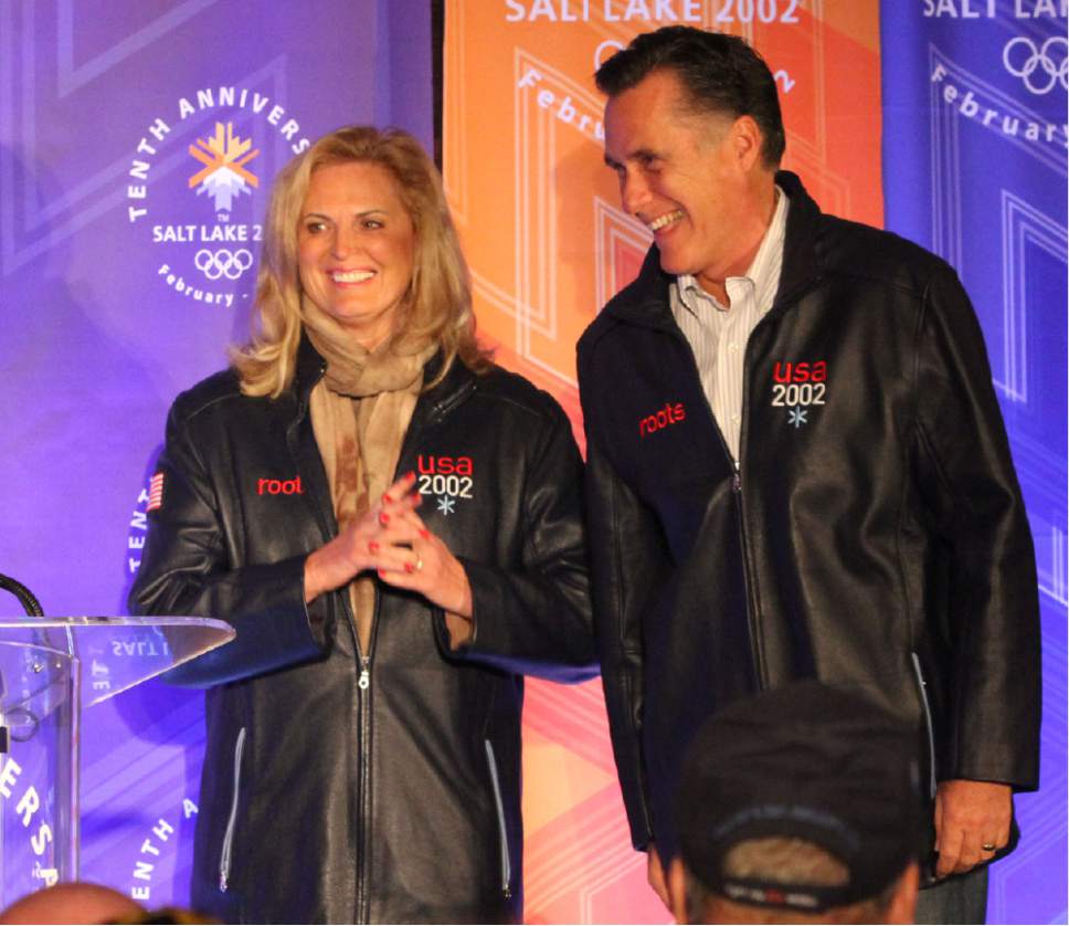 Rick Egan  | The Salt Lake Tribune 

 Ann and Mitt Romney smile as they take the stage before he speaking to a group of former SLOC members in the Grande Hall at the Gateway Center, Saturday, February 18, 2012.