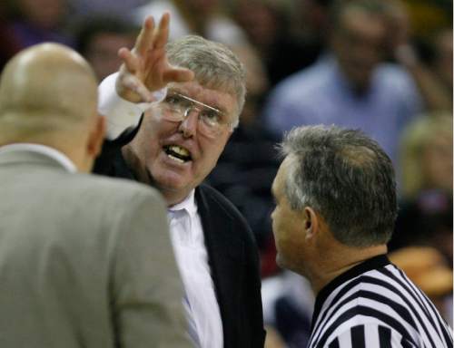 Utah State coach Stew Morrill, has a few words with the Referee, as the Aggies beat the Utes when the time keeper forgot to start the clock with 2.4 seconds remaining in the game, in basketball action at the Dee Glen Smith Spectrum Monday, December 22, 2008  
Rick Egan/The Salt Lake Tribune