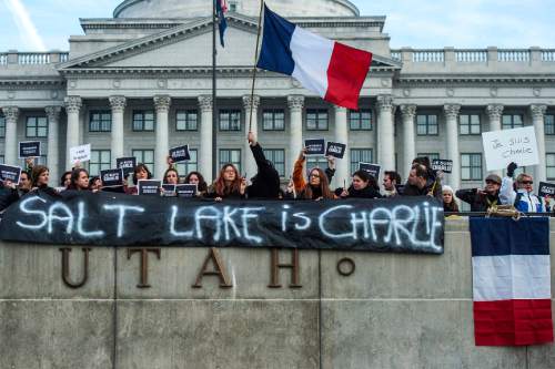 Chris Detrick  |  The Salt Lake Tribune
Members of the French community participate in a rally in support of the Parisian satirical magazine Charlie Hebdo at the Utah State Capitol on Saturday.