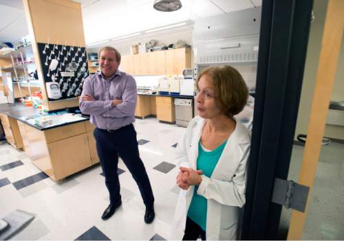 Steve Griffin  |  The Salt Lake Tribune

Paul Bartel, director of therapeutic discovery at the John A. Moran Eye Center and Norma Miller, senior lab custodian of the eye repository at the John A. Moran Eye Center at the University of Utah, in one of the labs at the center in Salt Lake City, Monday, December 22, 2014. The center has partnered with Allergan, a major pharmaceutical company, to try to find a cure for macular degeneration. This kind of corporate sponsorship of research is increasingly common in universities, but this particular deal is unusual because it's very early in the discovery process.