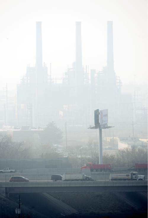 Jeremy Harmon  |  The Salt Lake Tribune

Traffic makes its way along I-15 while Salt Lake City is covered in a heavy inversion Friday, Jan. 9, 2105.