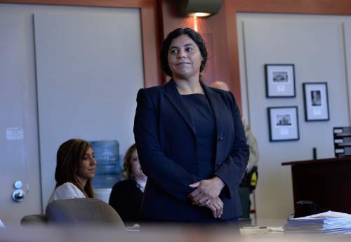 Scott Sommerdorf   |  The Salt Lake Tribune
Legal defender Brenda Viera listens as she is introduced to those attending the first day of veterans' court. Third District Court has started a veterans' court for military veterans who have had drug and alcohol problems and low-level run-ins with the law. Judge Royal Hansen presides, Thursday, January 8, 2015.