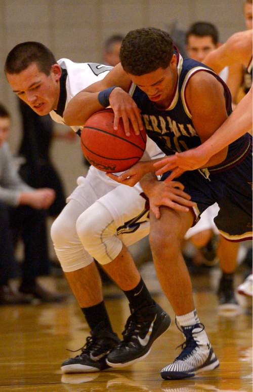 Leah Hogsten  |  The Salt Lake Tribune
Riverton's Denver Nageli and Joey Andrews pressure Herriman's Jaden Vaughn for the ball. Riverton High School boys basketball team defeated Herriman High School 53-49 at the during their game Tuesday January 13, 2015.