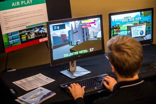 Chris Detrick  |  The Salt Lake Tribune
Second year masters student James Hulse plays the game ìBad Air Day: Play It Like ëUCAIRíî at the University of Utah Guest House Tuesday January 13, 2015.  ìBad Air Day: Play It Like ëUCAIRíî is a new web-based game for teens that introduces them to the factors that create the hazy, cough-inducing pollution that plagues the Salt Lake Valley during the winter months. It looks and plays like a 3-D, flying game, but it teaches why Utahís air-pollution woes are local and frequently misunderstood.