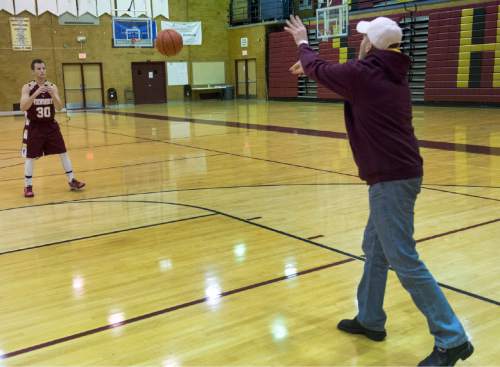 Rick Egan  |  The Salt Lake Tribune

Darin Richins rebounds the ball for his son, Josh Richins, in the Viewmont High Gym, Monday, December 15, 2014