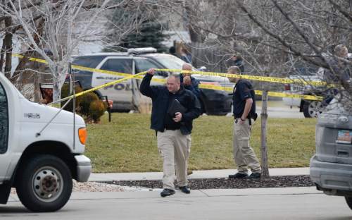 Francisco Kjolseth  |  The Salt Lake Tribune
Draper and West Valley police officers investigate the scene of an officer involved shooting in the Cranberry Hill neighborhood in Draper on Wednesday morning, Jan. 14, 2015. A West Valley police officer on his way to work who asked for back up from Draper police on a possible narcotics arrest shot and killed the suspect when he brandished a knife during the struggle to arrest him.