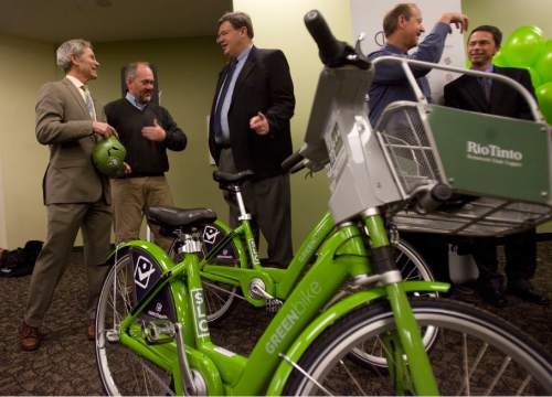Tribune file photo
 Salt Lake City Mayor Ralph Becker, talks with (from left) Salt Lake City Council members Stan Penfold and Carlton Christensen during the launch event for SLC Bike Share at the Wells Fargo building in Salt Lake City on April 8, 2013. The program is a partnership between Salt Lake City, the Downtown Alliance, the Salt Lake Chamber and SelectHealth.  The program will start with 100 GREENbikes and 10 stations around downtown.