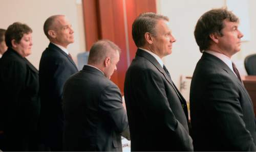 Al Hartmann  |  The Salt Lake Tribune

Marc Sessions Jenson, second from left, and his brother Stephen R. Jenson, second from right, stand with their lawyers at the start of their trial in Salt Lake City on Wednesday, January 14, 2015. They are charged with defrauding investors in a luxury ski resort near Beaver, Utah.