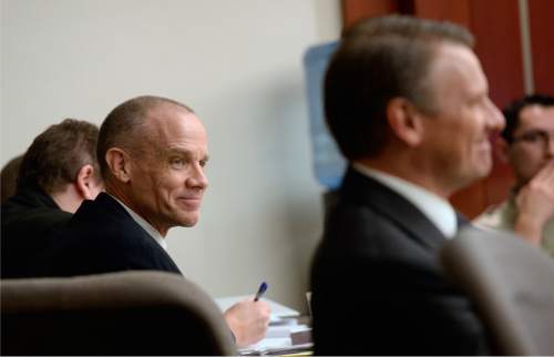 Al Hartmann  |  The Salt Lake Tribune

Marc Sessions Jenson, left, smiles with his brother Stephen R. Jenson, right, during opening arguments in Salt Lake City on Wednesday, January 14, 2015.  The brothers are charged with defrauding investors in a luxury ski resort near Beaver, Utah.