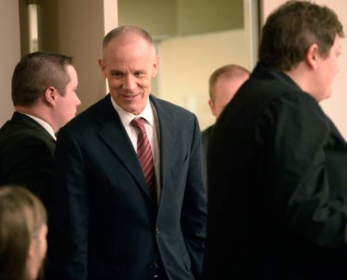Al Hartmann  |  The Salt Lake Tribune

Marc Sessions Jenson enters court in Salt Lake City on Wednesday, January 14, 2015. Trial began today for Jenson and his brother Stephen R. Jenson who are charged with defrauding investors in a luxury ski resort near Beaver, Utah.