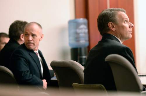 Al Hartmann  |  The Salt Lake Tribune

Marc Sessions Jenson, left, and his brother Stephen R. Jenson sit in court as they wait for proceedings to begin in Salt Lake City on Wednesday, January 14, 2015. They are charged with defrauding investors in a luxury ski resort near Beaver, Utah.