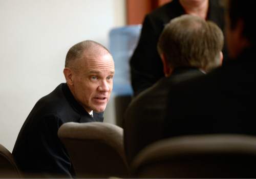 Al Hartmann  |  The Salt Lake Tribune

Marc Sessions Jenson, left, and his brother Stephen R. Jenson talk as they wait for proceedings to begin in Salt Lake City on Wednesday, January 14, 2015. They are charged with defrauding investors in a luxury ski resort near Beaver, Utah.